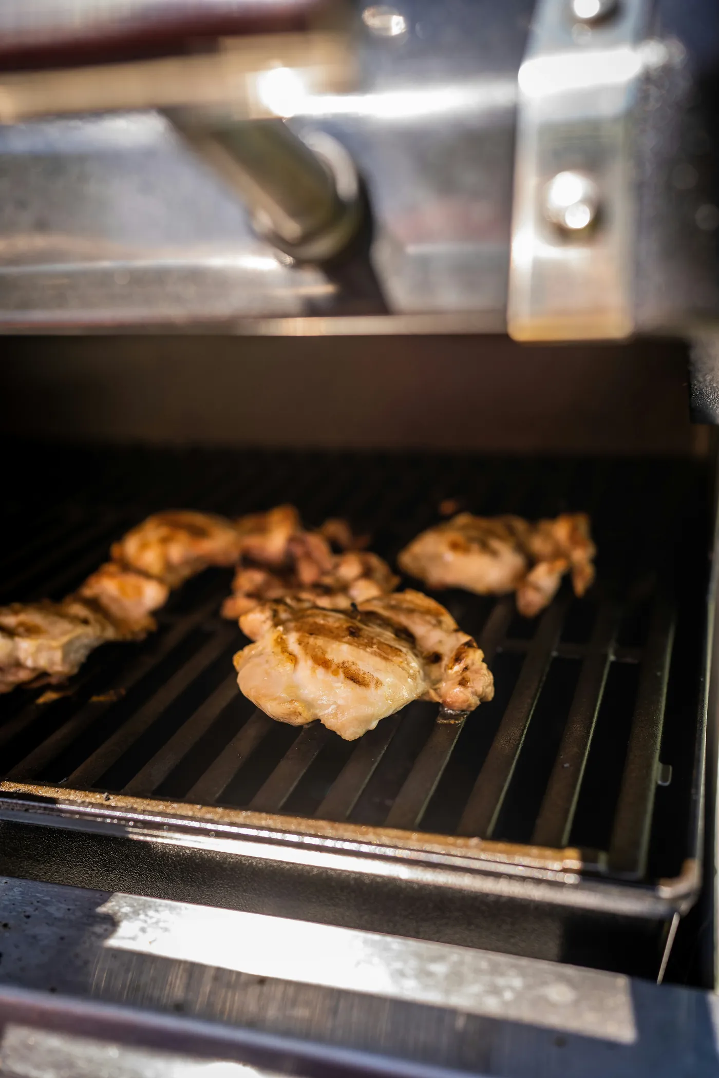 Illustrative stock photograph of chicken cooking on a grill